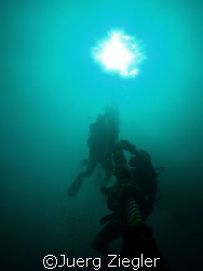 Divers ascending from 40m deep dive on line

Raja - Phu... by Juerg Ziegler 
